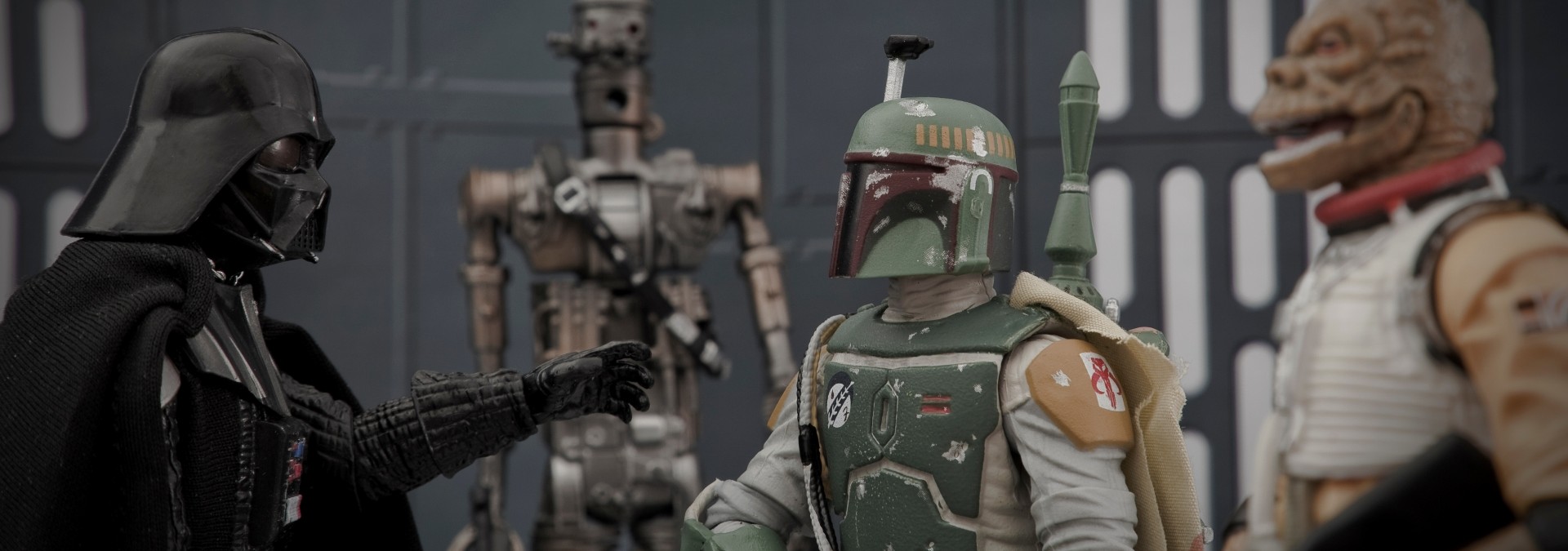 Star Wars action figures Darth Vader, IG-88, Boba Fett, and Bossk.