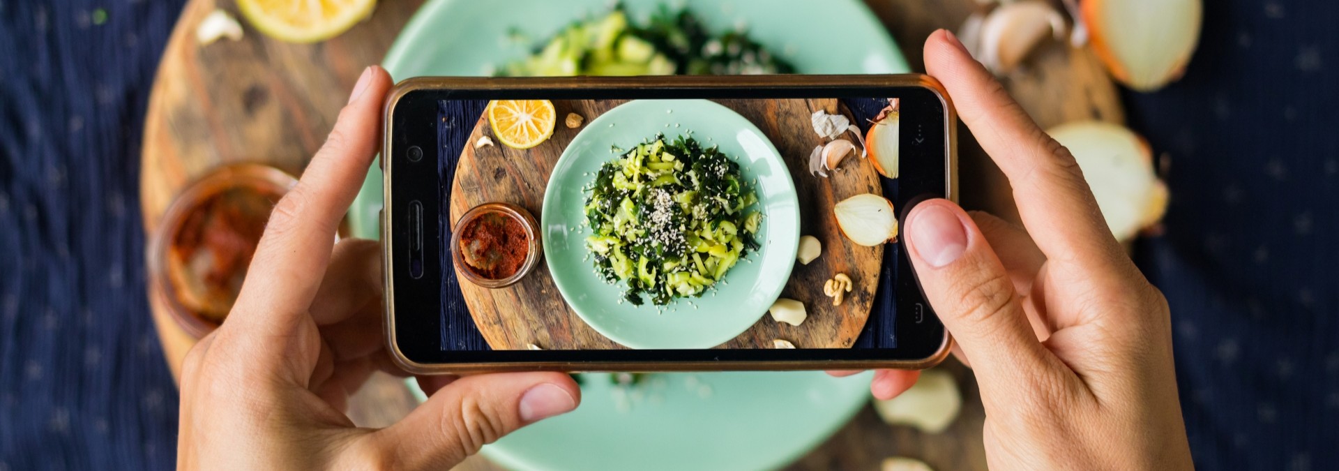 Woman taking Instagram food pics for her website